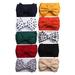 KIDOCHEESE big bows headband with a 6-inch bow for gentle, non-slip comfort.
