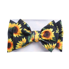 KIDOCHEESE bow headband for photoshoots enhances cute baby looks.