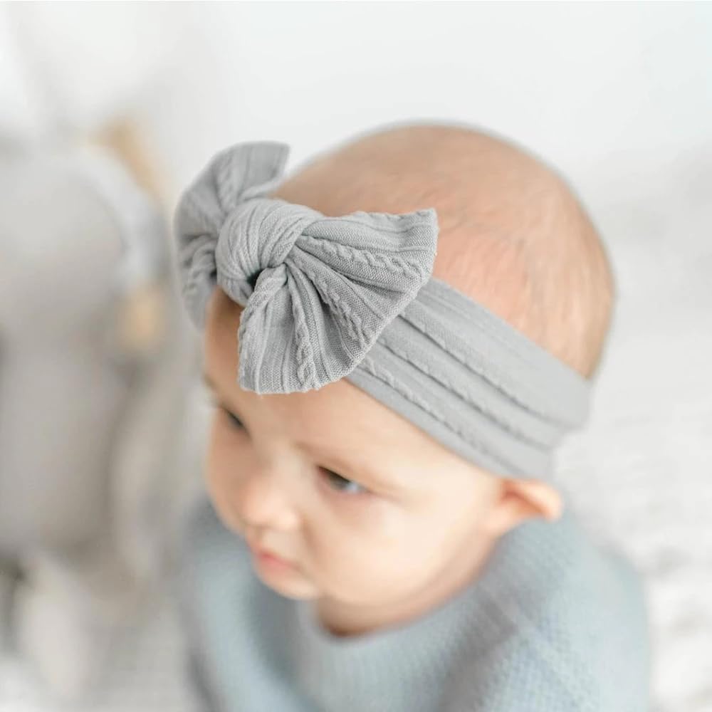 Kidocheese brown headband with bow providing secure, comfortable fit.