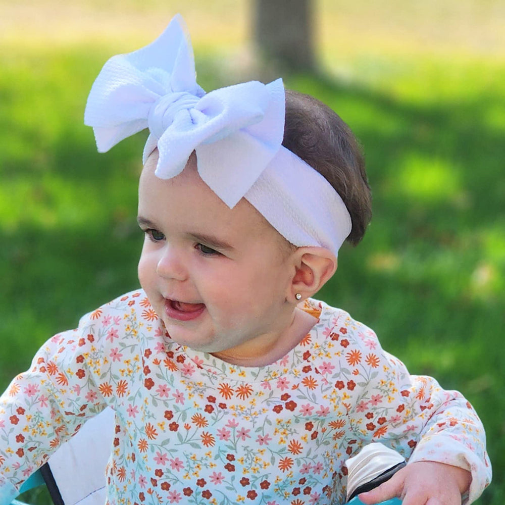 KIDOCHEESE elastic nylon hairband offers a soft, comfortable fit.