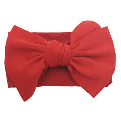 KIDOCHEESE hairband adjustable-stretch adapts from infant to toddler head sizes.