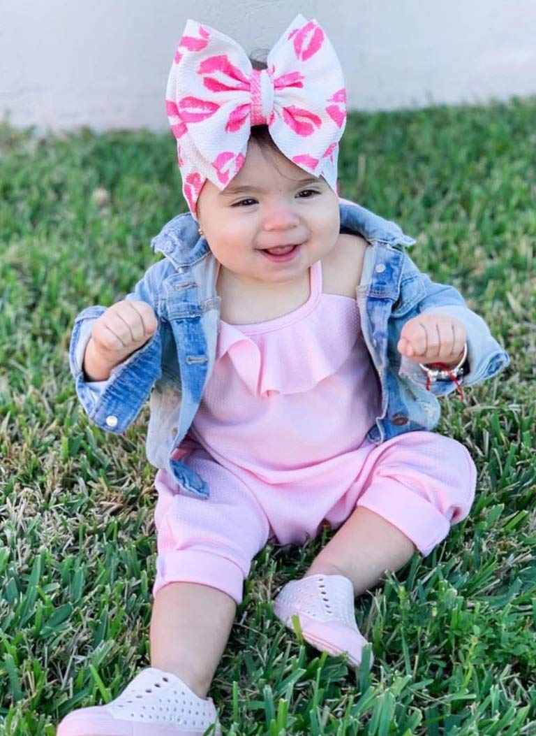KIDOCHEESE headband with bow on toddler, versatile for birthdays and photos.