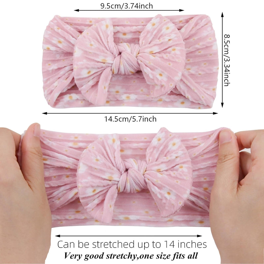 Kidocheese newborn bow headband in pink with soft stretch for delicate hair.