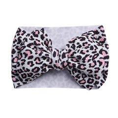 KIDOCHEESE soft elastic headband showing stretchable band suitable for newborns to toddlers.