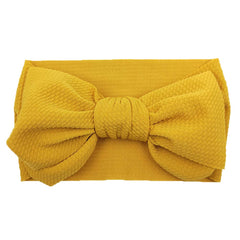 KIDOCHEESE ten-pack color headbands for versatile styling with any outfit.