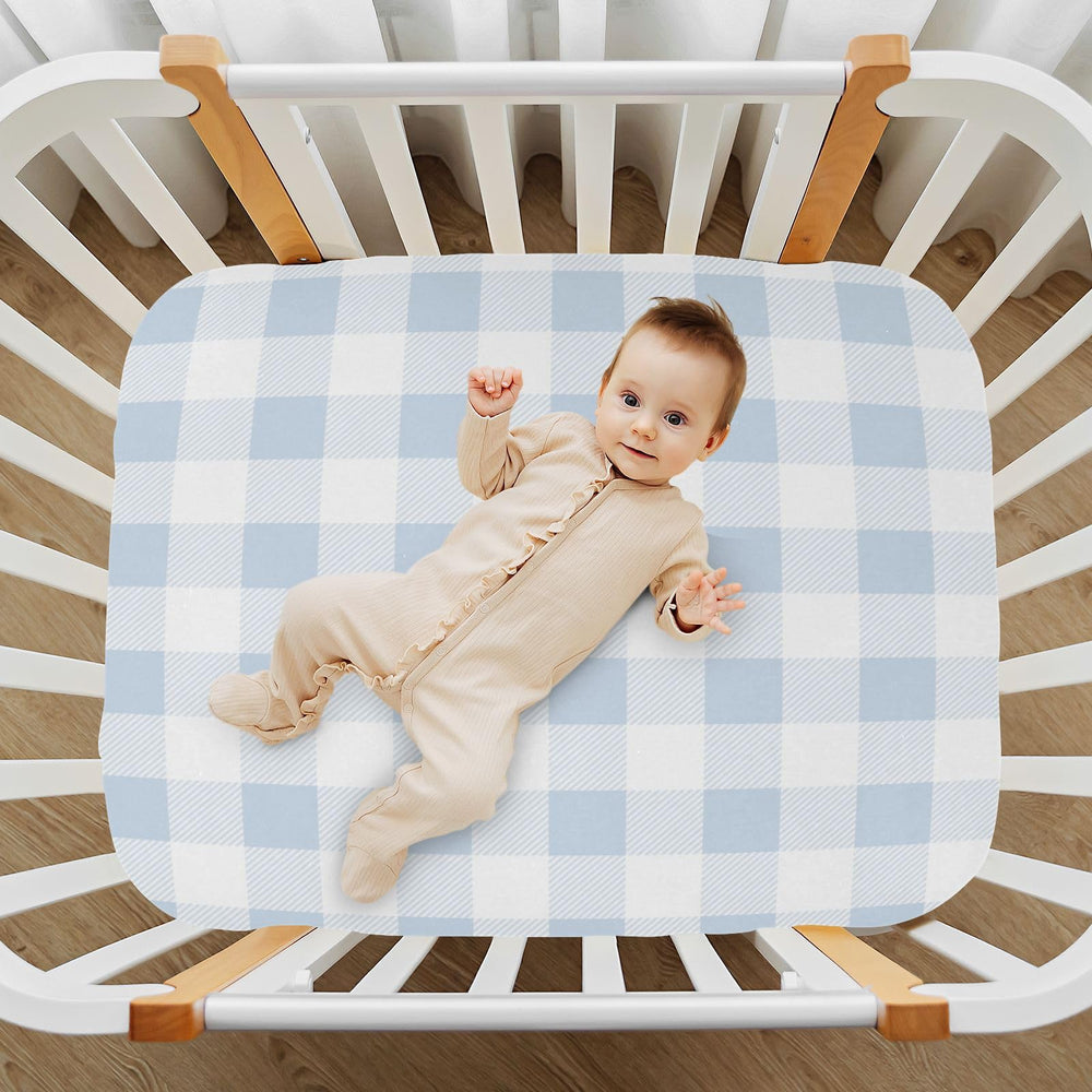 Kigai blue gingham sheet adds warm nursery decor setting.