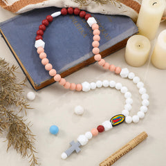 Kigeli rose pink cross baptism rosary close-up of soft silicone beads