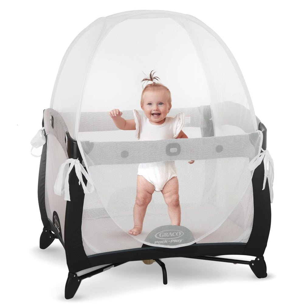 Kindersense Pack N Play Tent over a playpen with a clear, breathable mesh top for safe supervision.