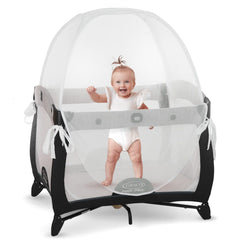 Kindersense Pack N Play Tent over a playpen with a clear, breathable mesh top for safe supervision.