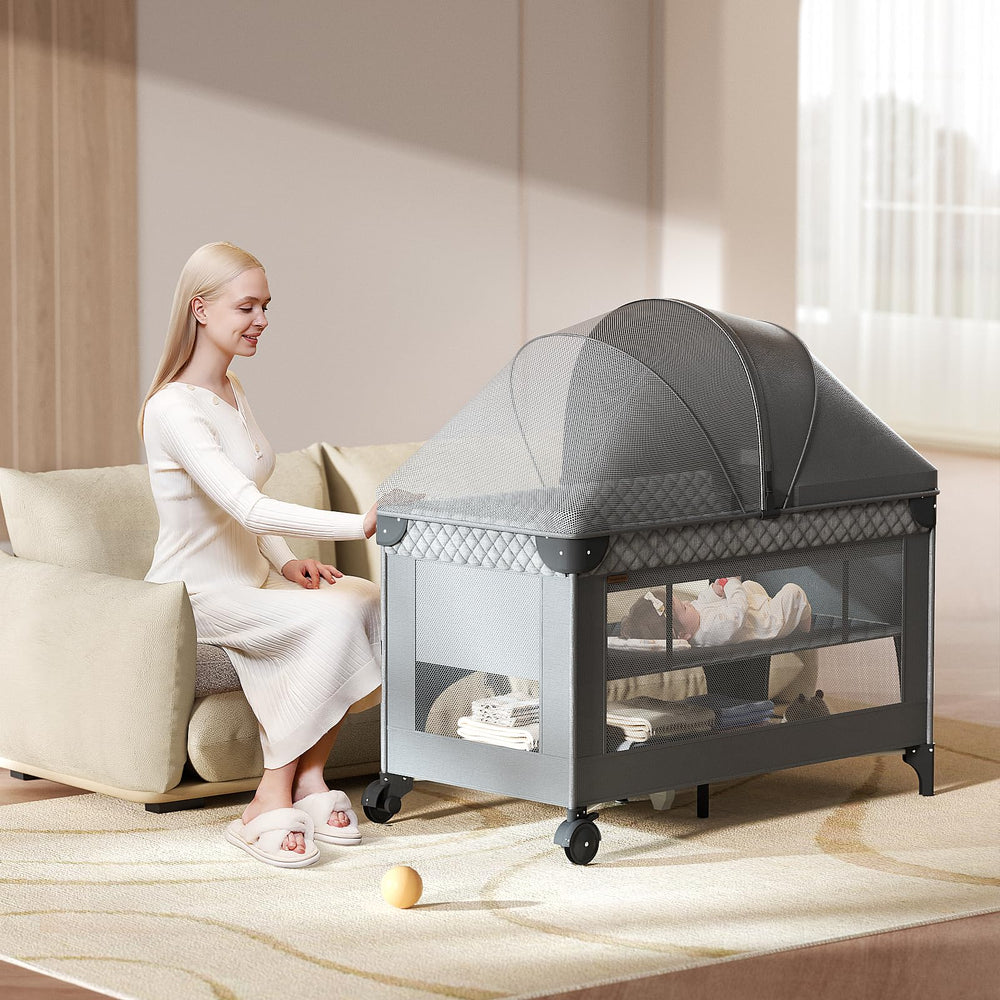 Kingobabys pack and play co-sleeper with side zipper supports close care.