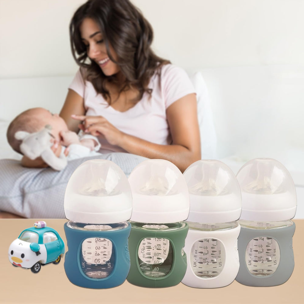 Kingwi Avent silicone sleeve in green on glass bottle protects against drops