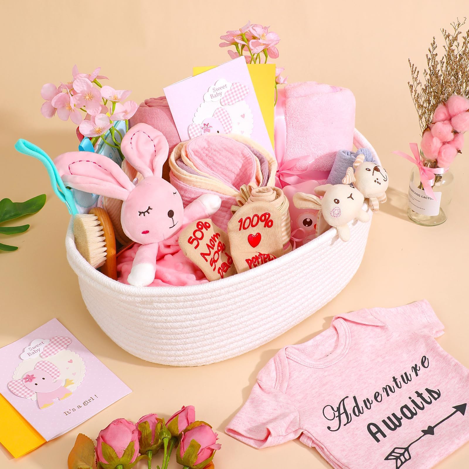 Kipwake pink rattle included for baby's early sensory play and soothing sounds.