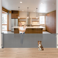 KISKIZ 85-inch wide retractable gate across a doorway for safe baby and pet access
