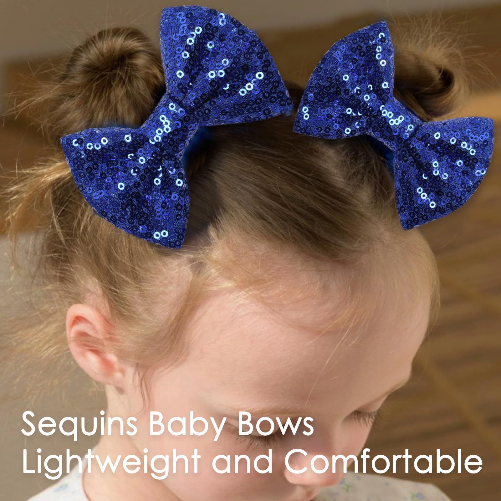 KISZU deep blue sequin bow clip on hair illustrating secure hold