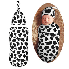 KiuLoam cow-print swaddle blanket for newborn warmth and comfort.