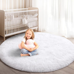 KIXINWA round rug with soft white surface for cozy bedrooms and play areas.