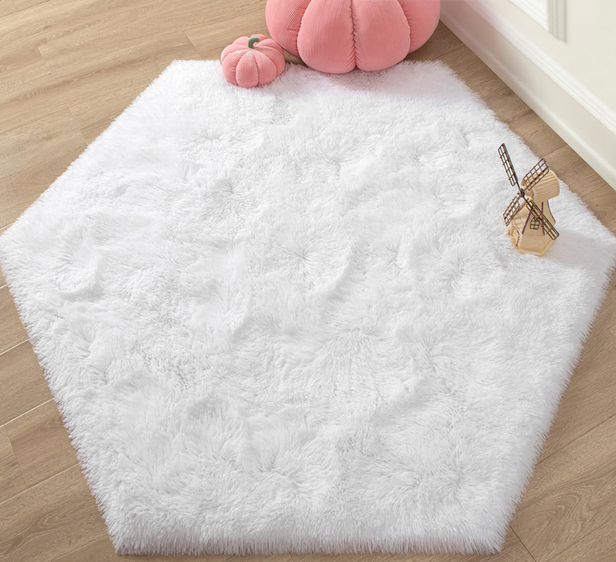 KIXINWA White Hexagon Rug in princess castle setup with soft surface for play.