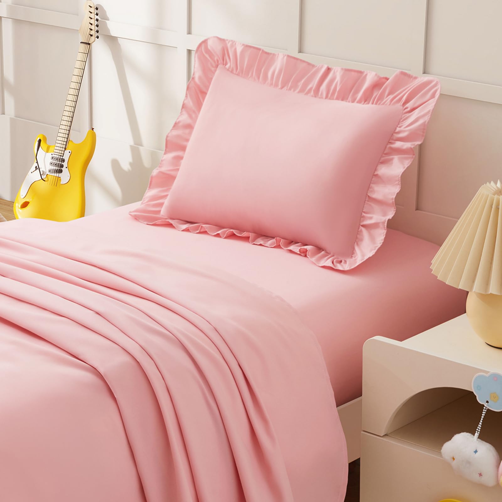 KKJIAF ruffle pillowcase in light pink adds cute, cozy crib style.