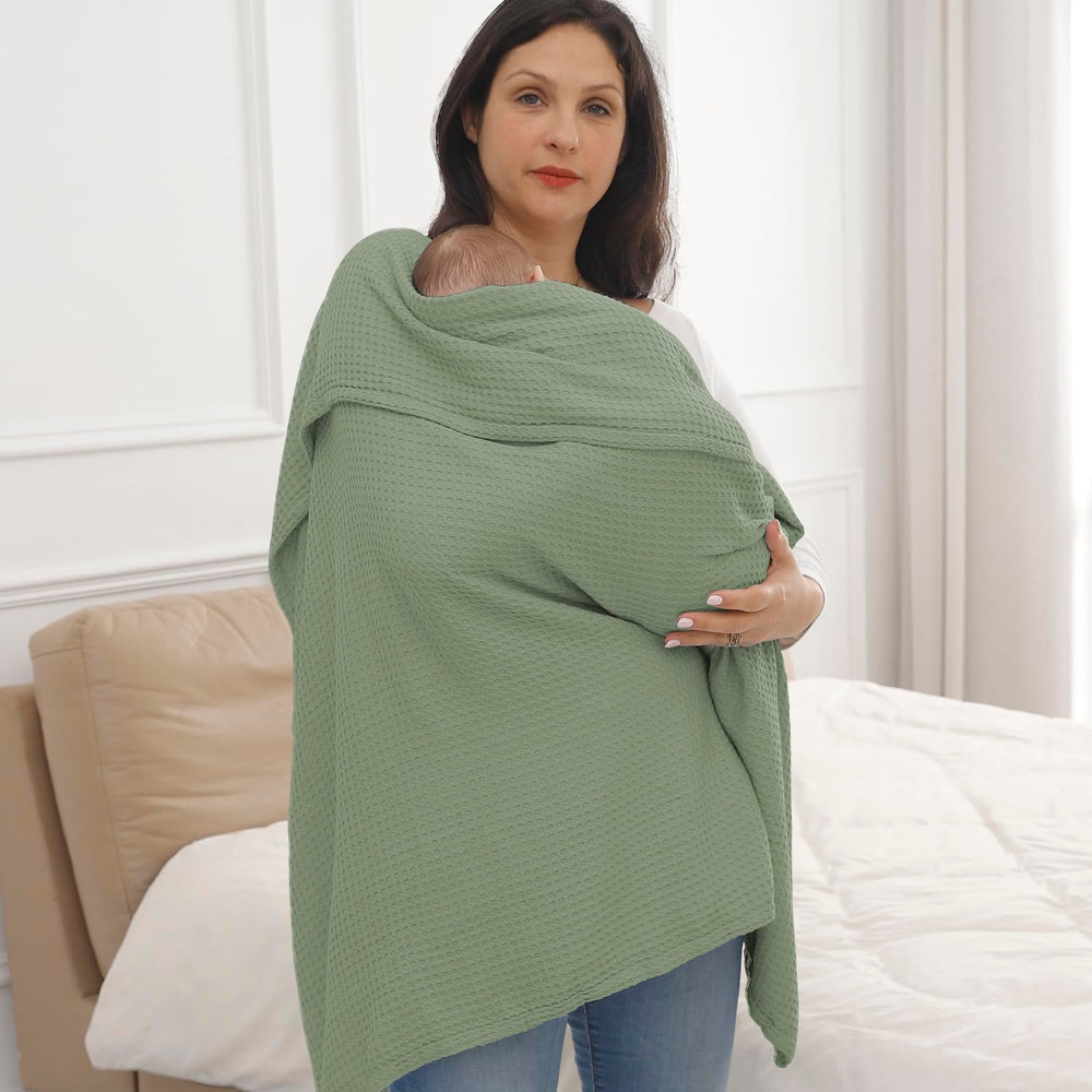 Kloovete Sage blanket laid as a bedside bed cover at night.