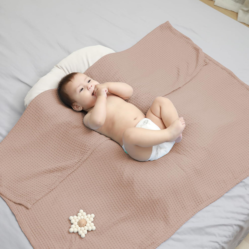 Kloovete baby blanket ready for swaddle and nursery use in clay