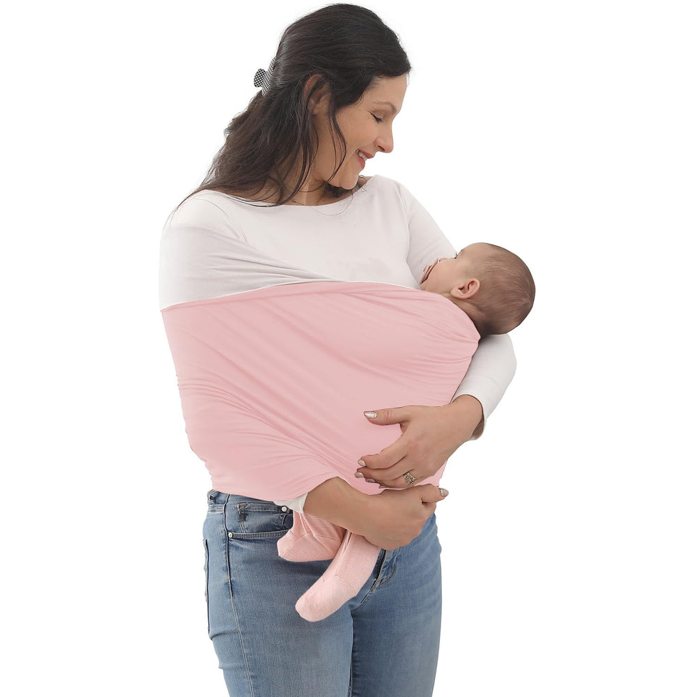 Kloovete baby wrap carrier in dusty pink demonstrates easy hands-free bonding and mobility.