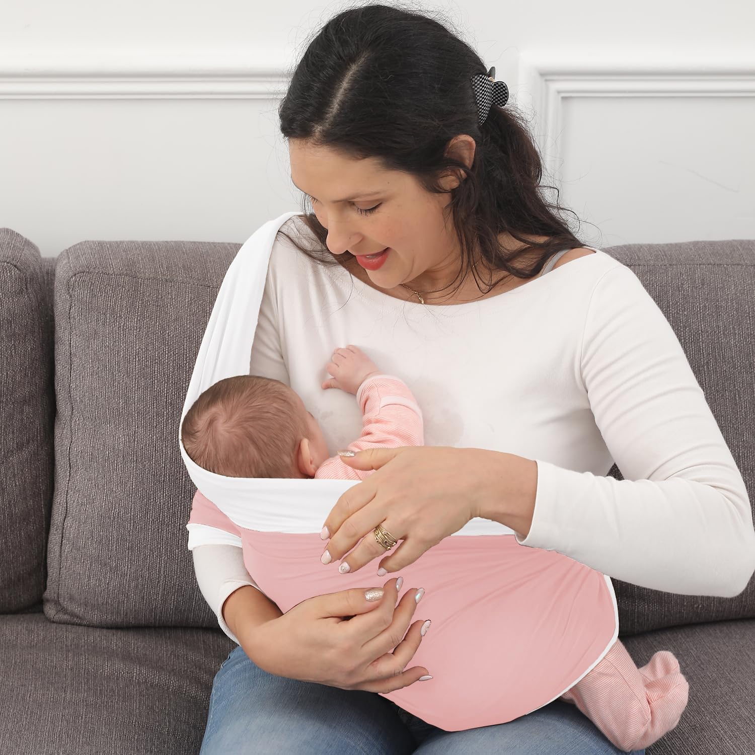 Kloovete newborn in sling shows secure hold with adjustable fit.