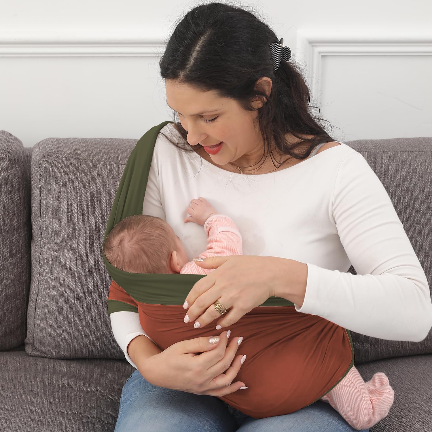 Kloovete wrap model wearing with infant, showcasing ergonomic support