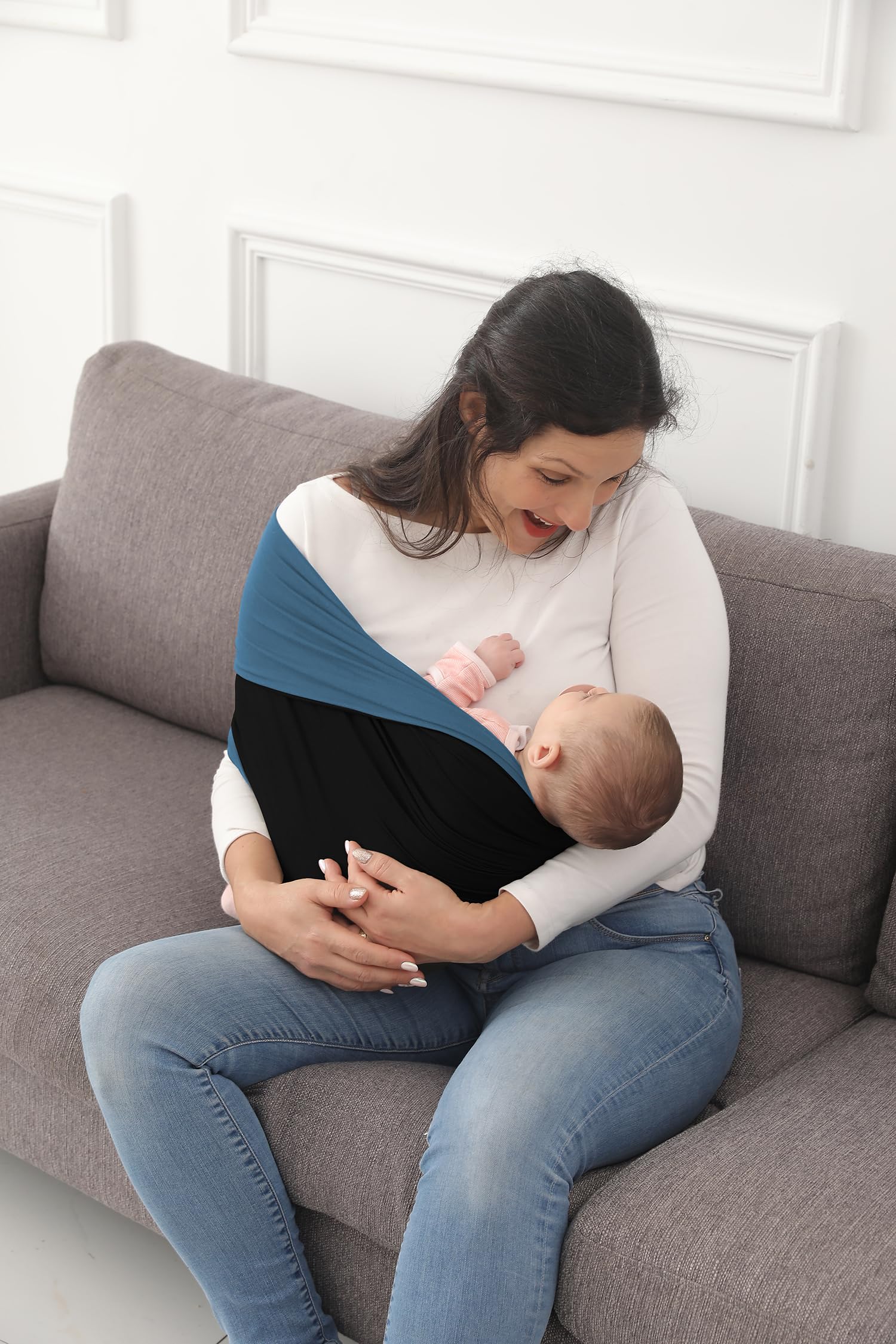 Kloovete baby wrap supports shoulder weight distribution.