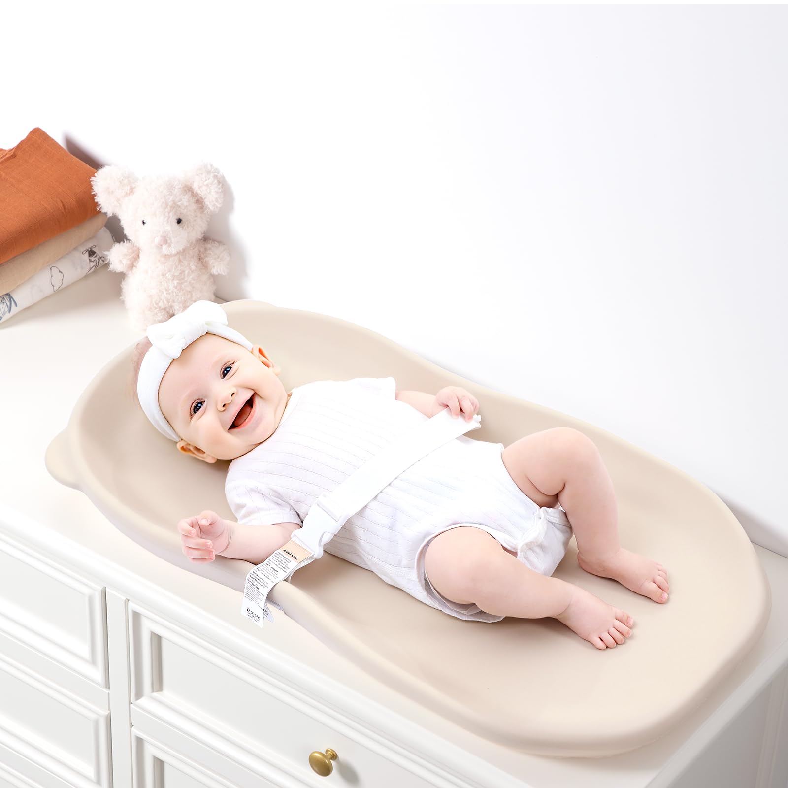 Knirose wipe-clean changing pad helps reduce laundry and mess during care routines.