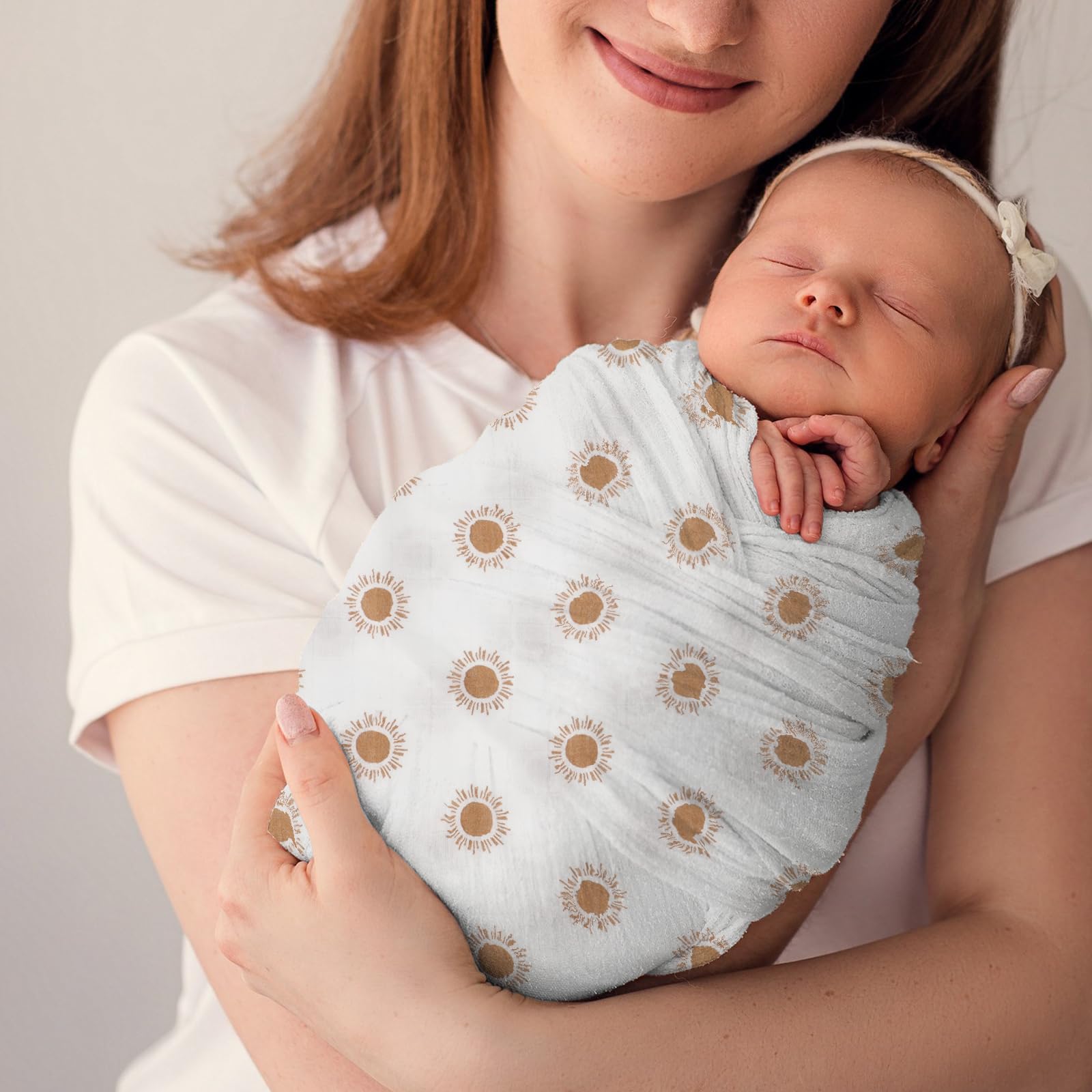Knirose receiving and nursing blanket offers versatile coverage.