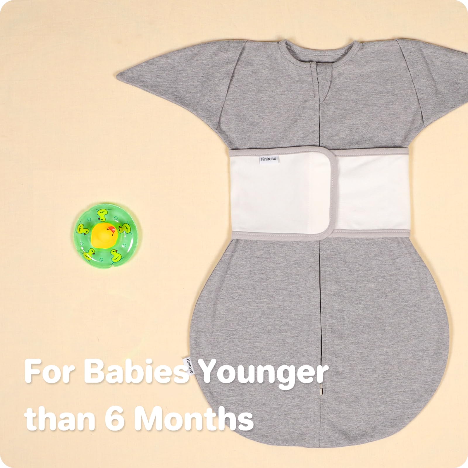 Step 1: placing baby in swaddle with Knirose over the sleeping bag.