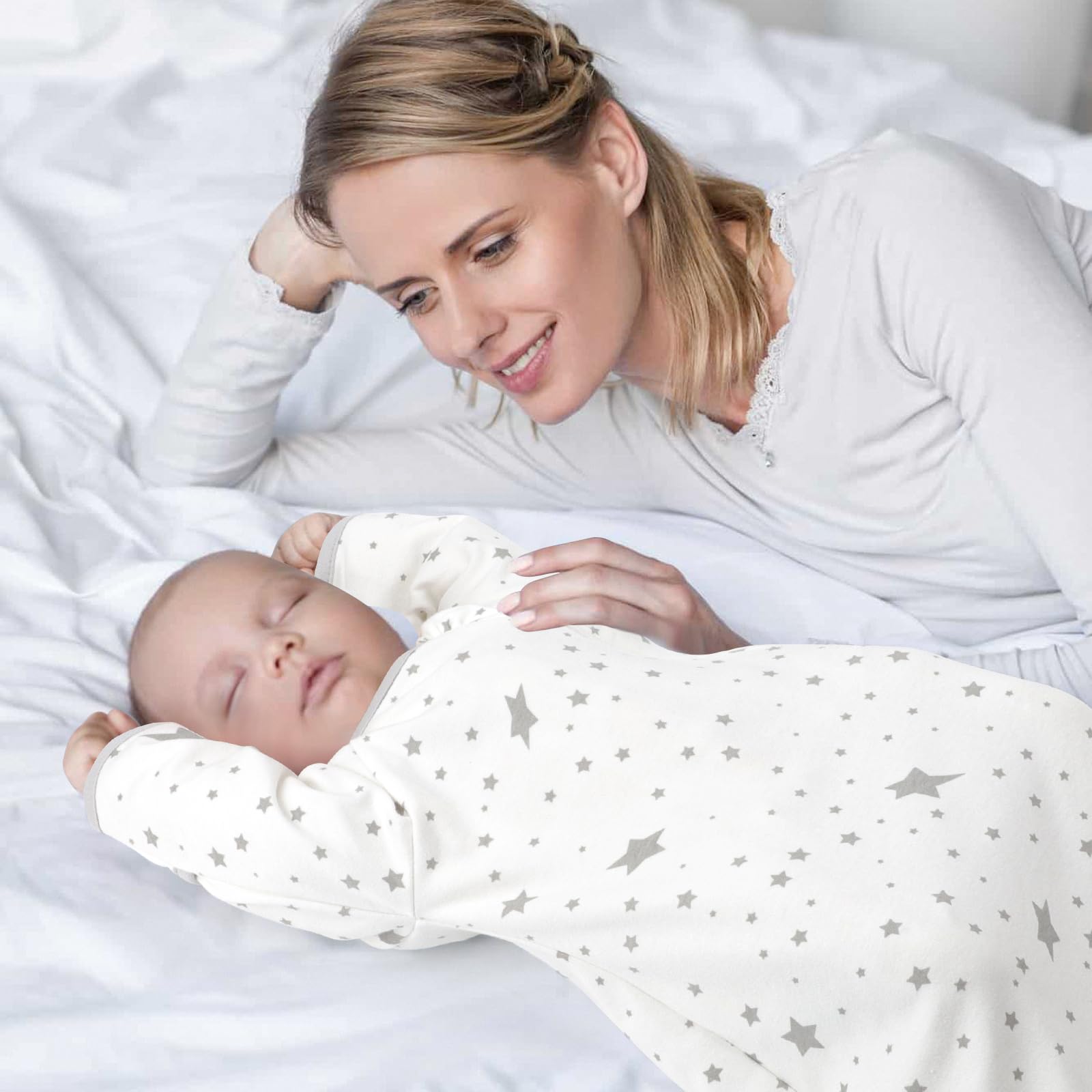 Knirose newborn-to-toddler style baby wearing the sleep sack in bed scene.