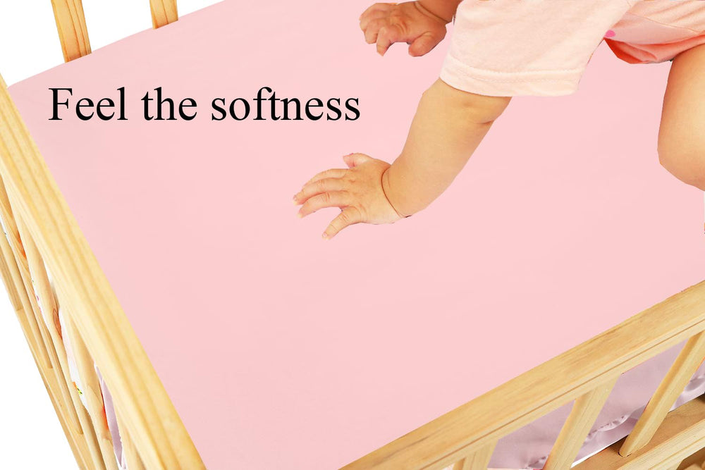Knlpruhk elastic 360° fit showing flexible stretch for crib sizes.