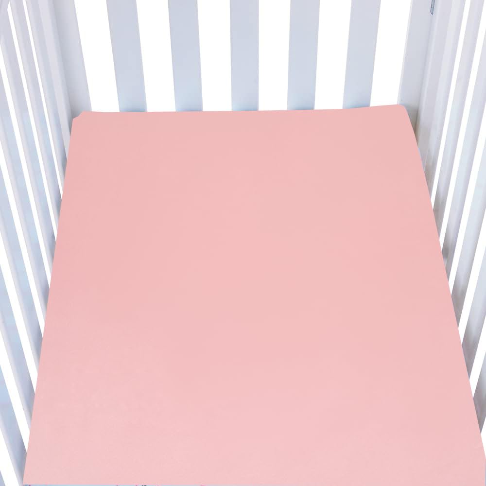 Knlpruhk silk fitted crib sheet on mattress showing surface smoothness for baby comfort.