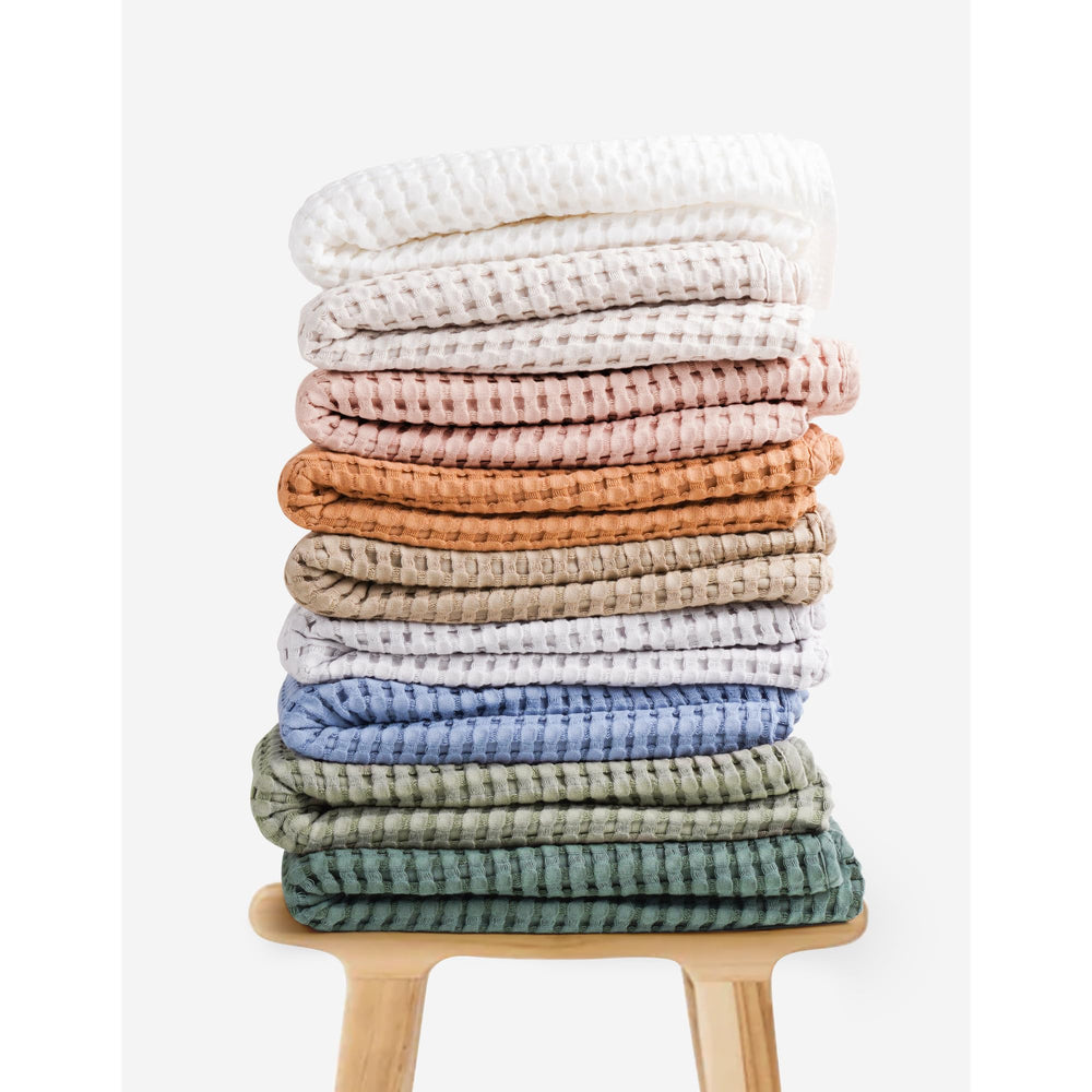 Gift-ready Konssy waffle blanket in neutral Amy Green.
