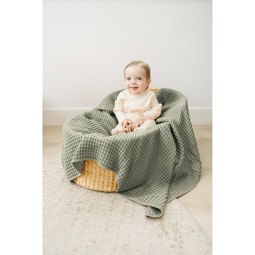 Konssy Amy Green waffle blanket used as newborn photography prop.
