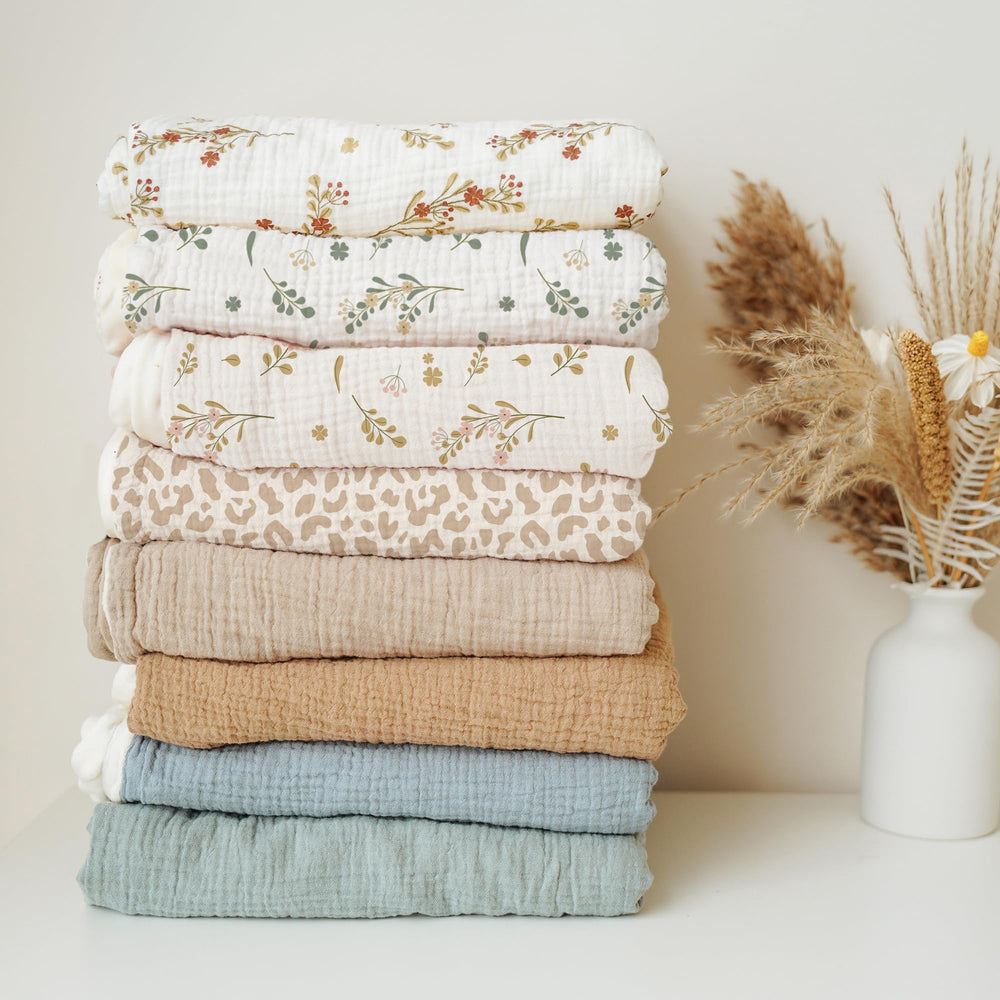 Konssy blanket serves many roles from swaddle to stroller cover.