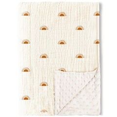 Konssy baby blanket with muslin front and dotted fleece back for gentle warmth.