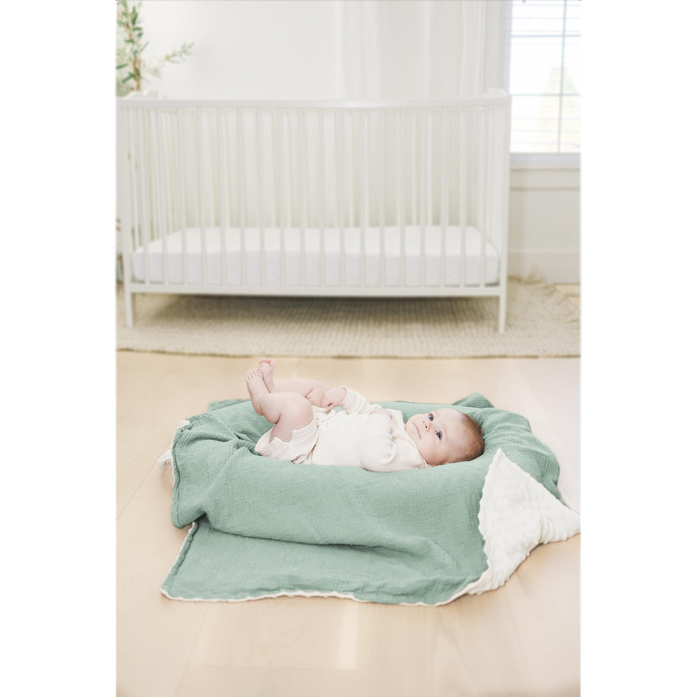 Konssy baby blanket used as swaddle or stroller cover for flexibility.