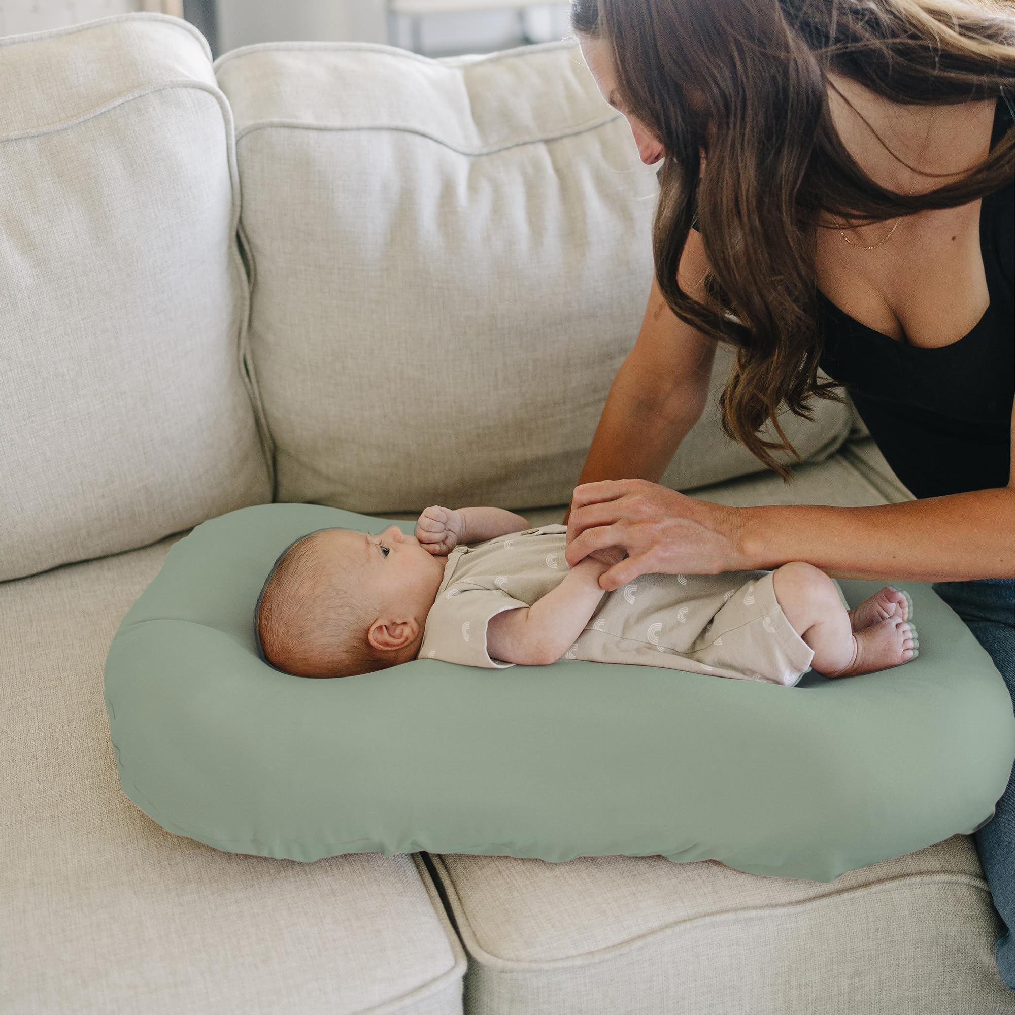 Konssy green leaves cover complements nursery decor while keeping surfaces clean