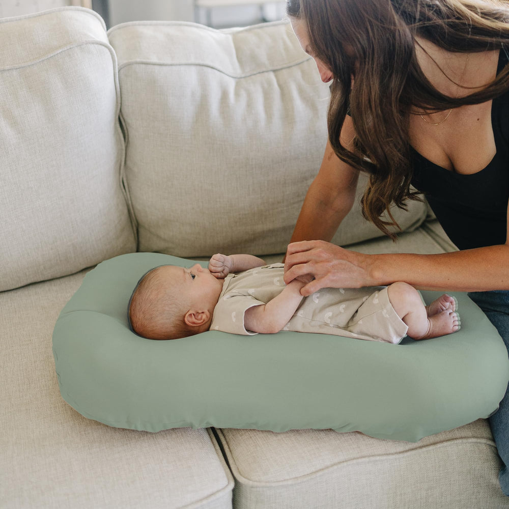 Konssy green leaves cover complements nursery decor while keeping surfaces clean