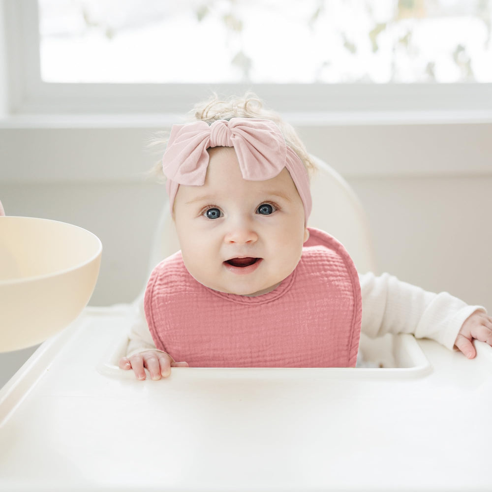 Konssy bibs shown as burp cloths and wipes for versatility
