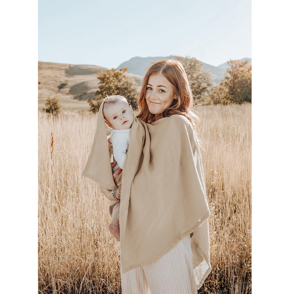 Konssy car-seat cover doubles as a stroller shield.