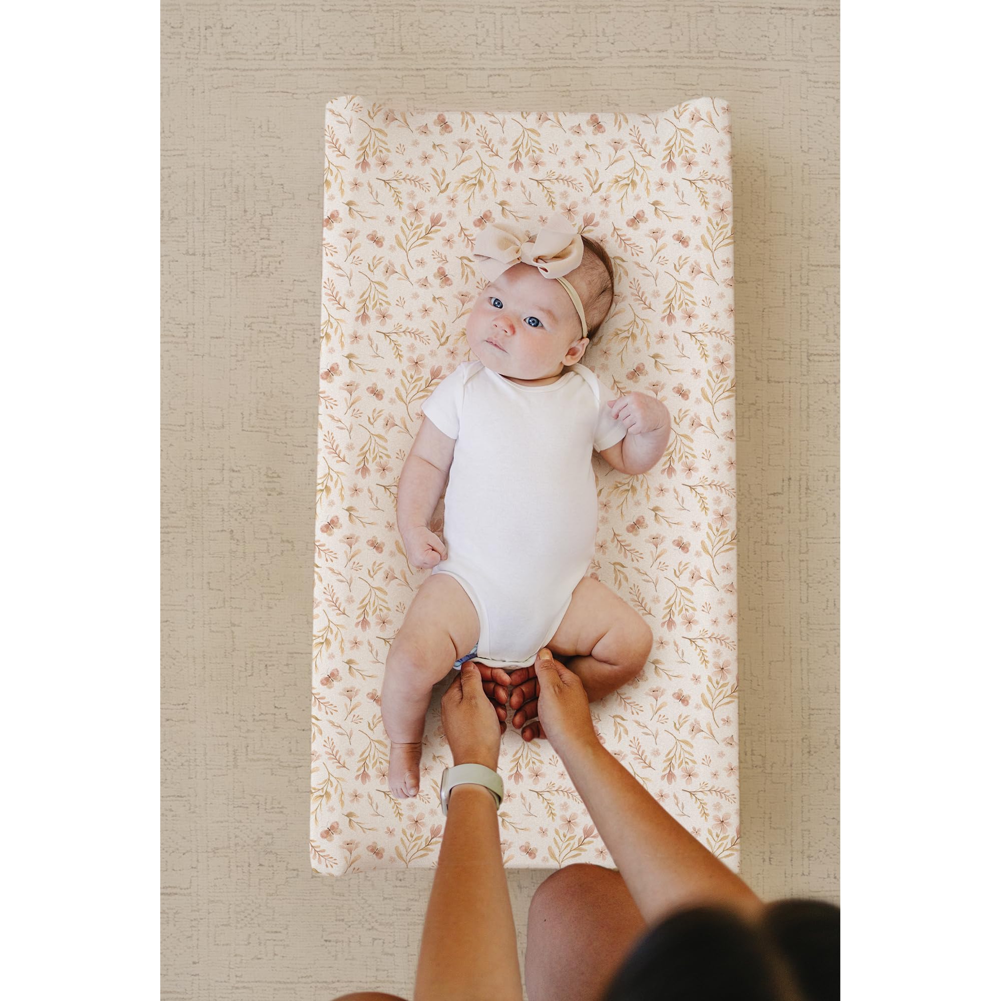 Konssy changing pad cover with 360-degree elastic for secure fit.