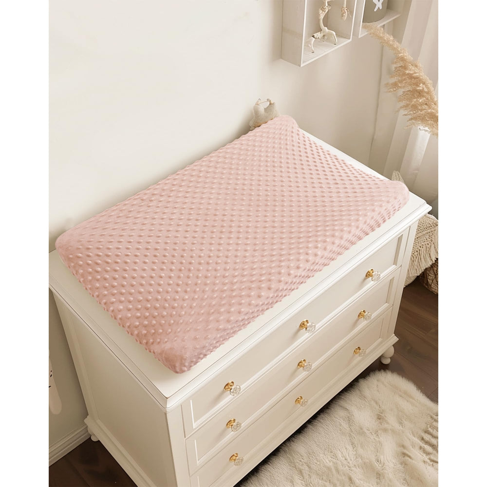 Konssy changing pad cover easy on/off with elastic edges.