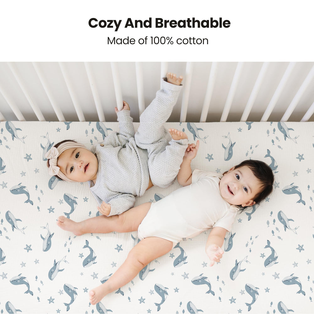 Two-pack crib sheets sized 28x52 inches for a snug fit on standard cribs.