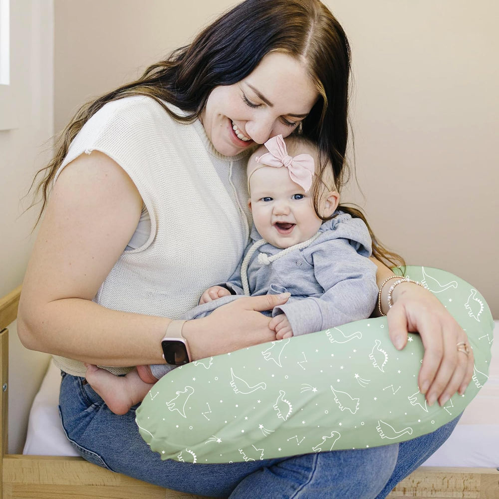 Konssy Dino Jungle nursing pillow cover with stretchy edges for a snug fit on standard pillows.