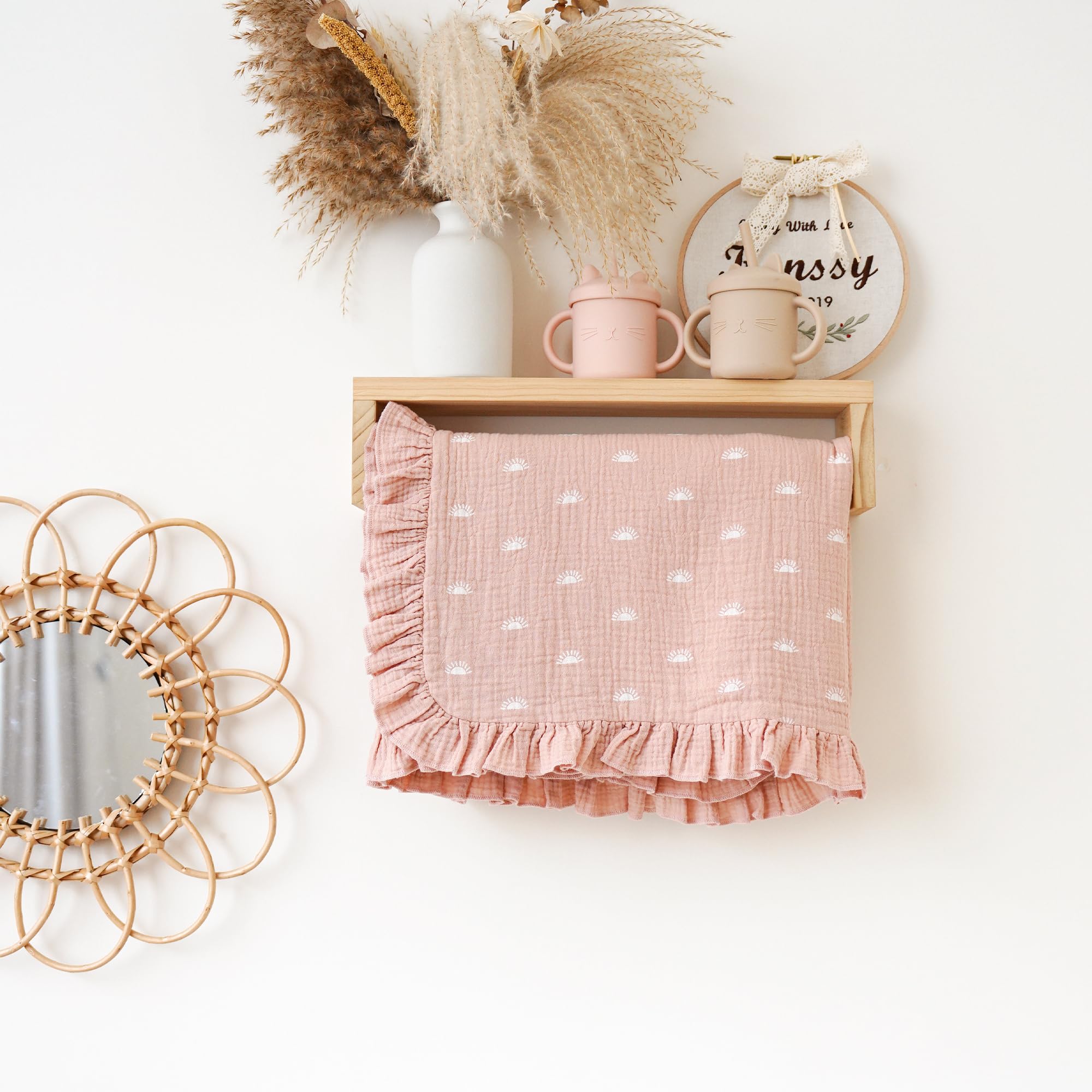 Konssy blanket floral design detail adds soft nursery charm.