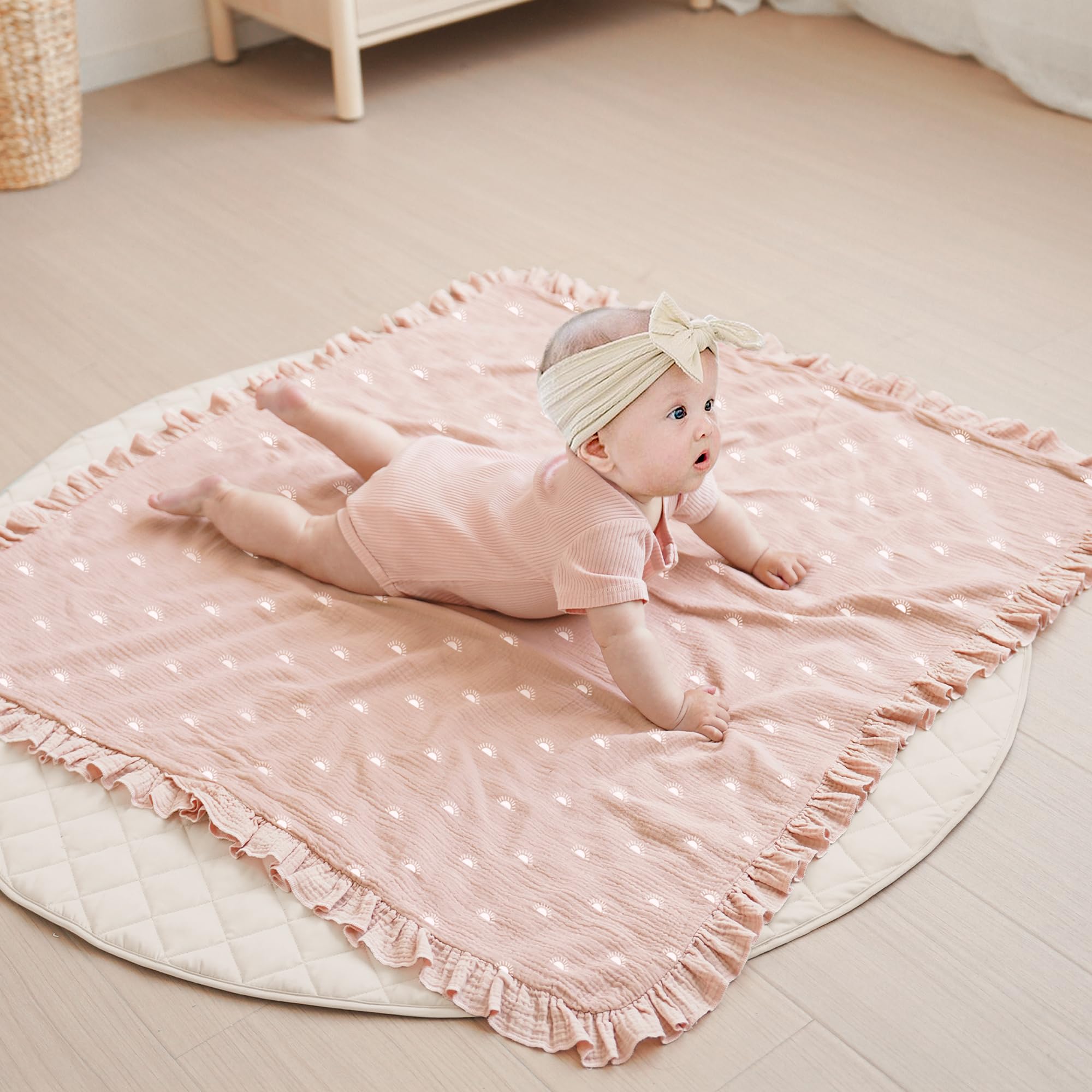 Konssy Flounce Muslin blanket shown swaddled for secure, comfy wrap.