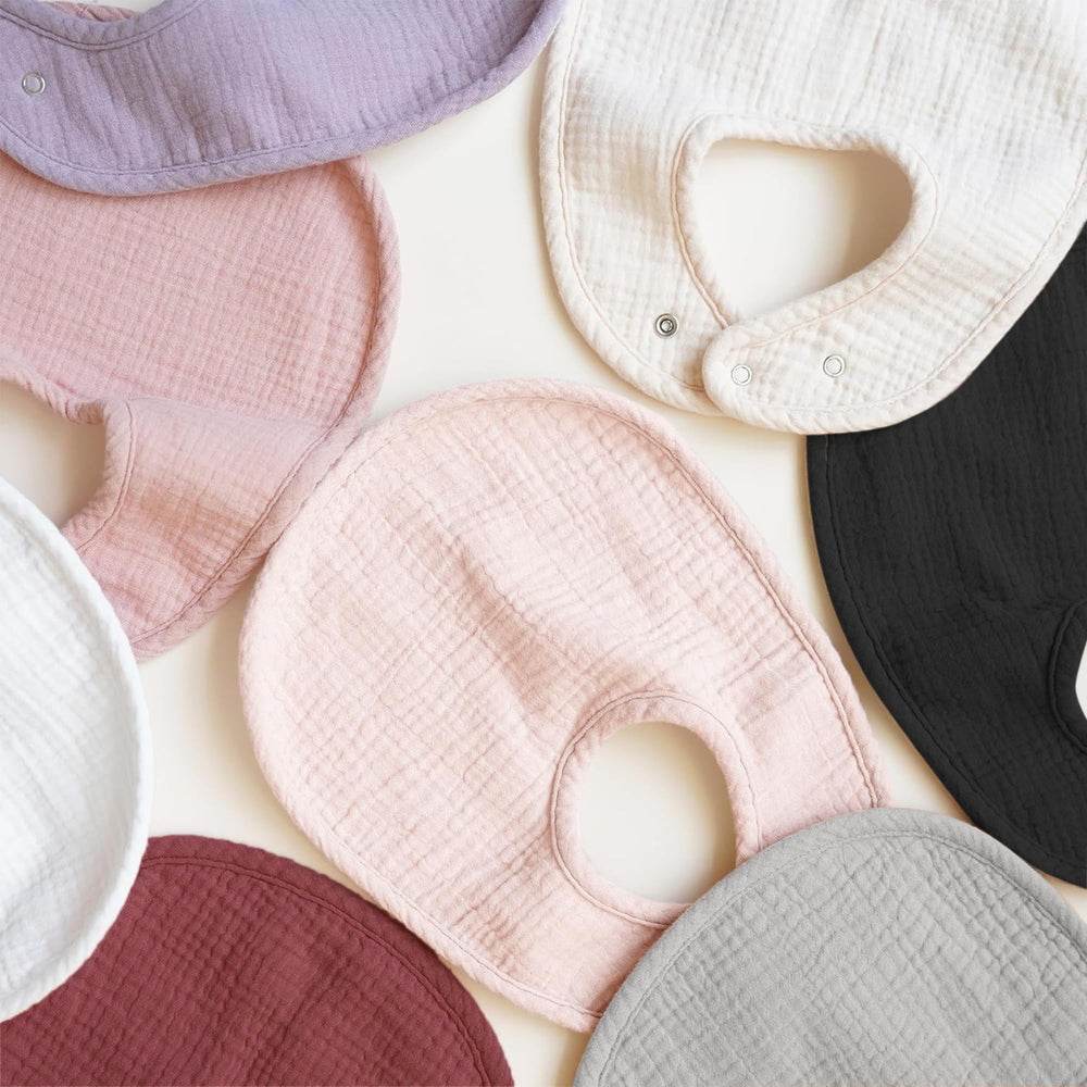 Konssy gift-ready baby bibs in eight-pack packaging for baby showers.